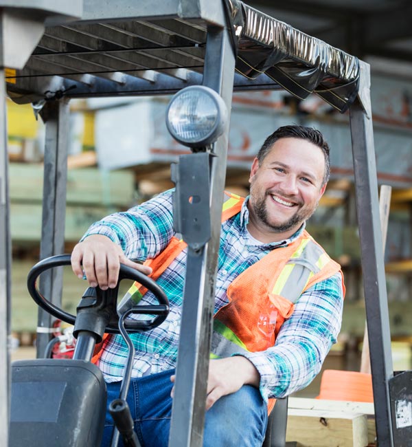 man driving forklift